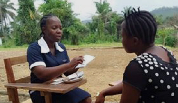 Liberian peer provider counseling a fellow student